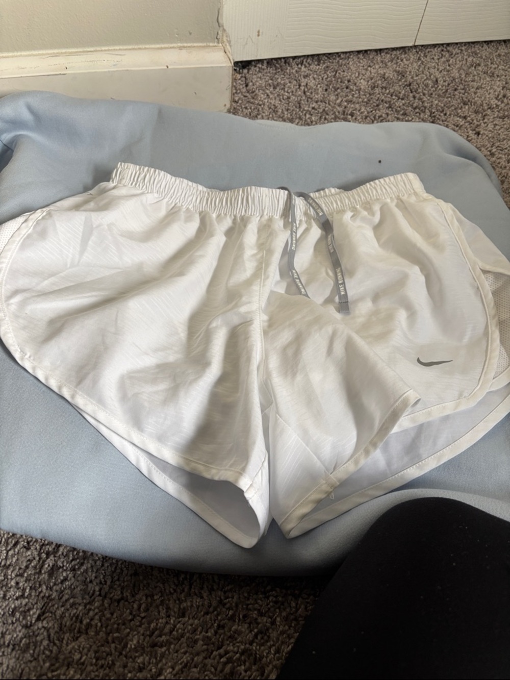 Nike Women's White Athletic Shorts with Gray Swoosh
